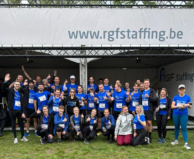 Corporate team celebrating together after completing a sporting event